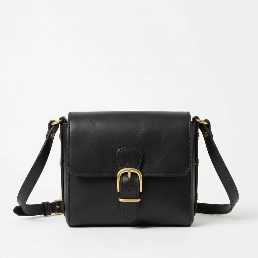 The same bag in black leather with brass hardware
